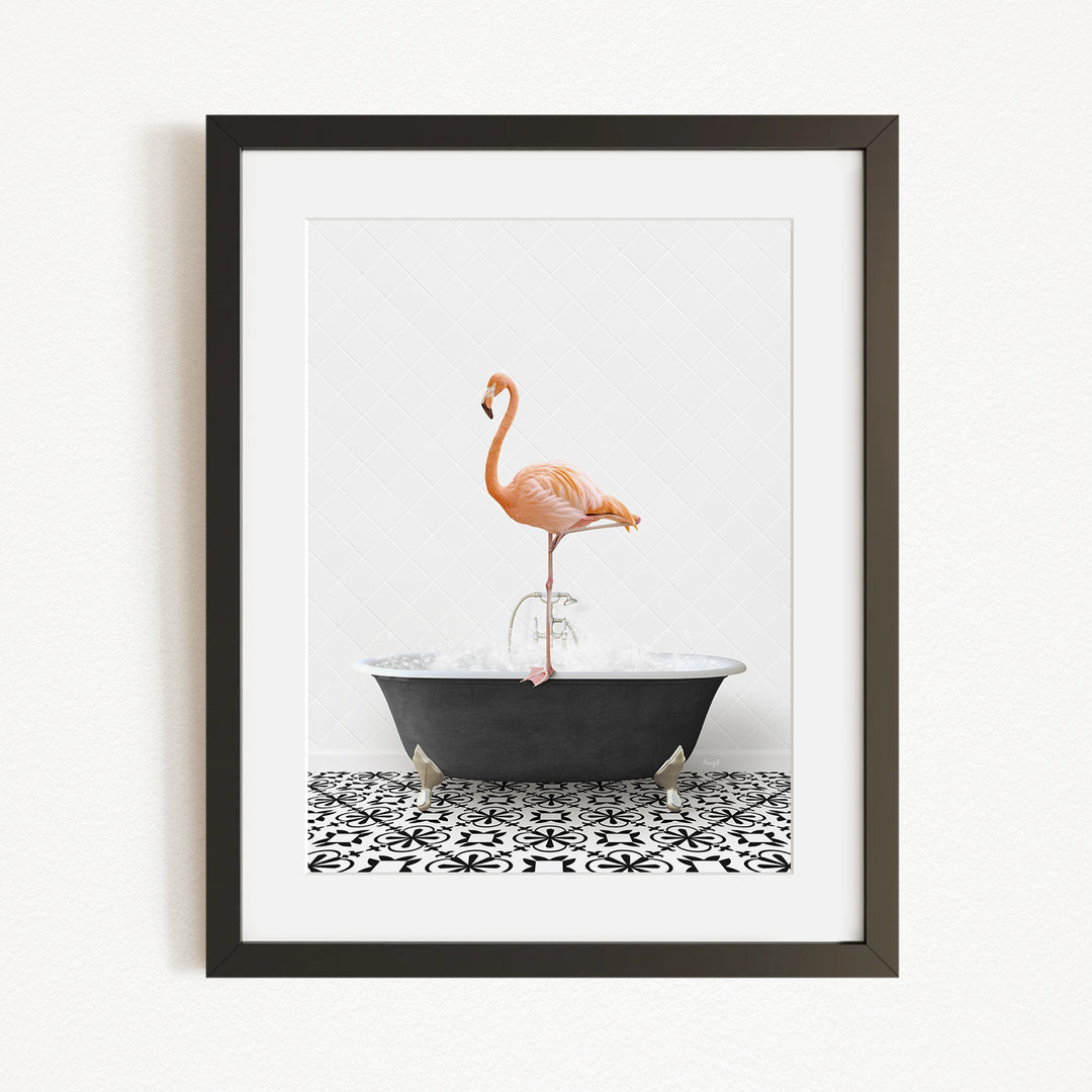 A framed image of a flamingo standing in a bathtub filled with water.