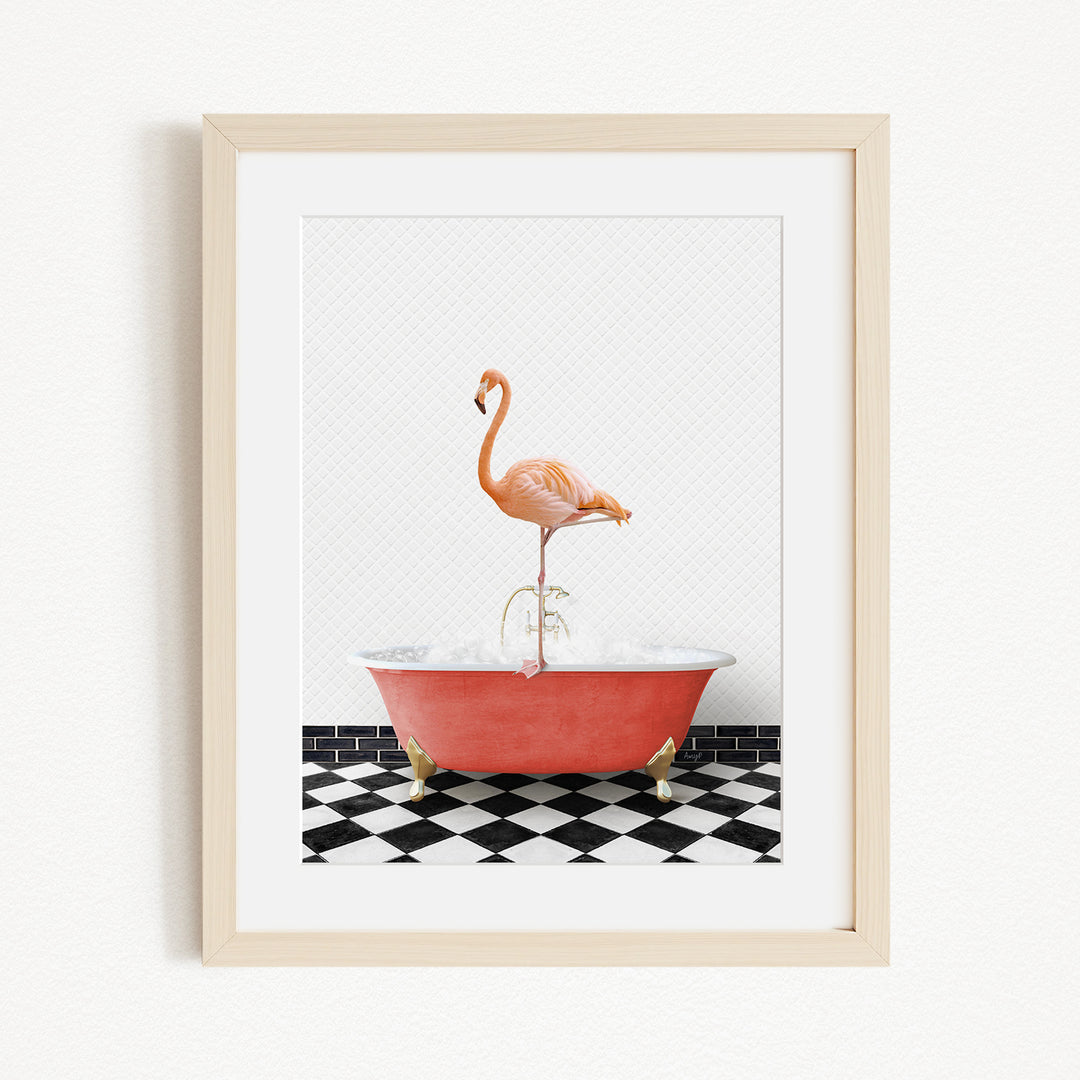 A framed image depicting a pink flamingo standing on a red bathtub with a black and white checkered floor.