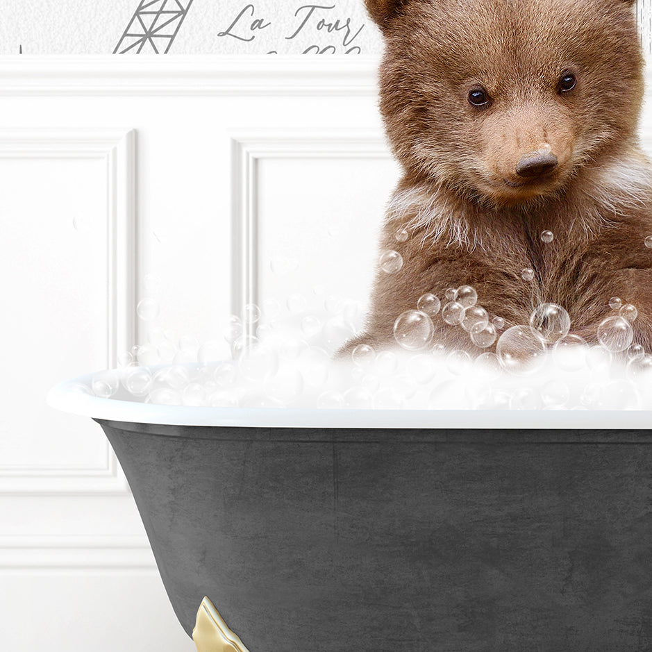 a brown bear sitting in a bath tub filled with bubbles