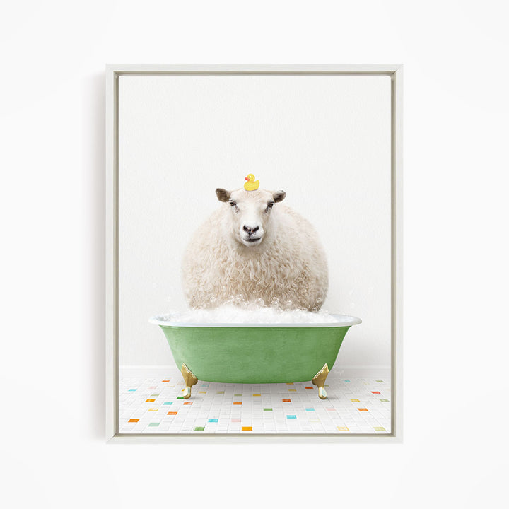 A fluffy white sheep sits in a green bathtub filled with bubbles, with a yellow rubber duck perched on its head.