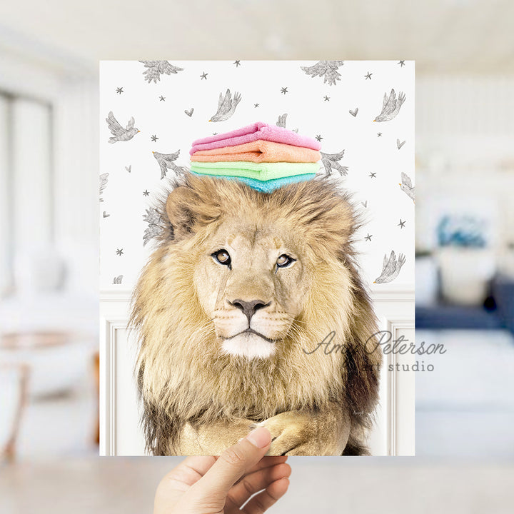 a hand holding a card with a picture of a lion