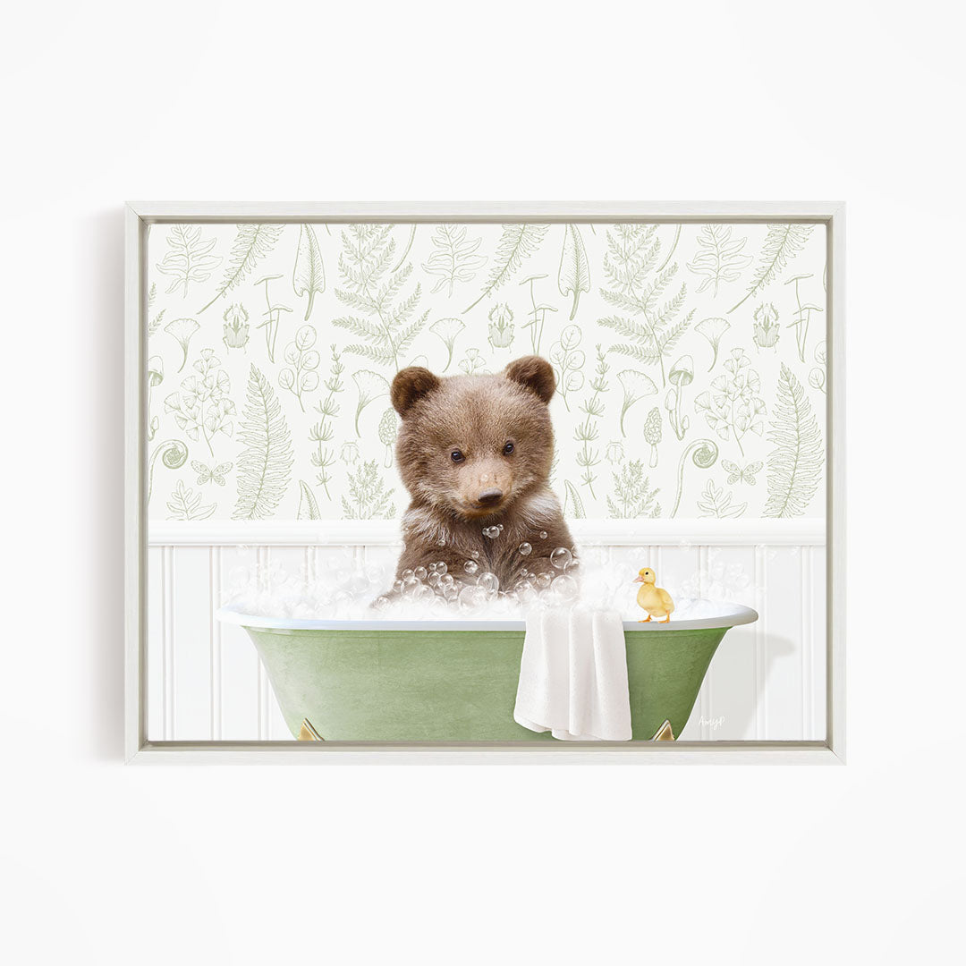 A brown bear sitting in a green bathtub, surrounded by bubbles, with a yellow duck nearby.