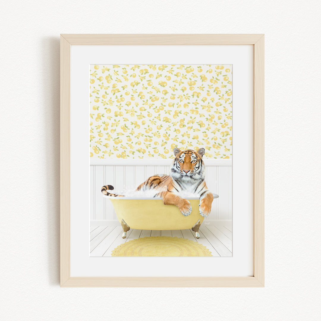 A tiger is sitting in a yellow bathtub, surrounded by a yellow and white floral pattern on the wall behind it.