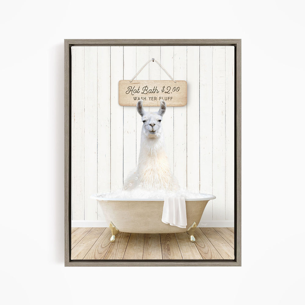 A white llama sitting in a bathtub, with a wooden sign above it that reads "Hot Bath $2.00 WASH YER FLUFF".