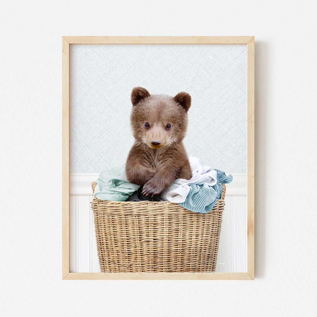 a picture of a teddy bear sitting in a basket