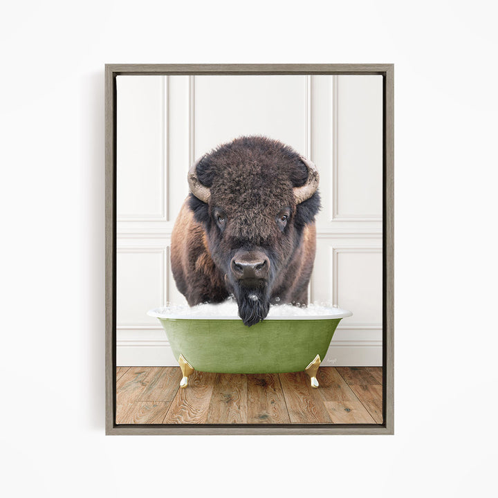 A buffalo with large horns is standing in a green bathtub filled with water, appearing to be enjoying the bath.