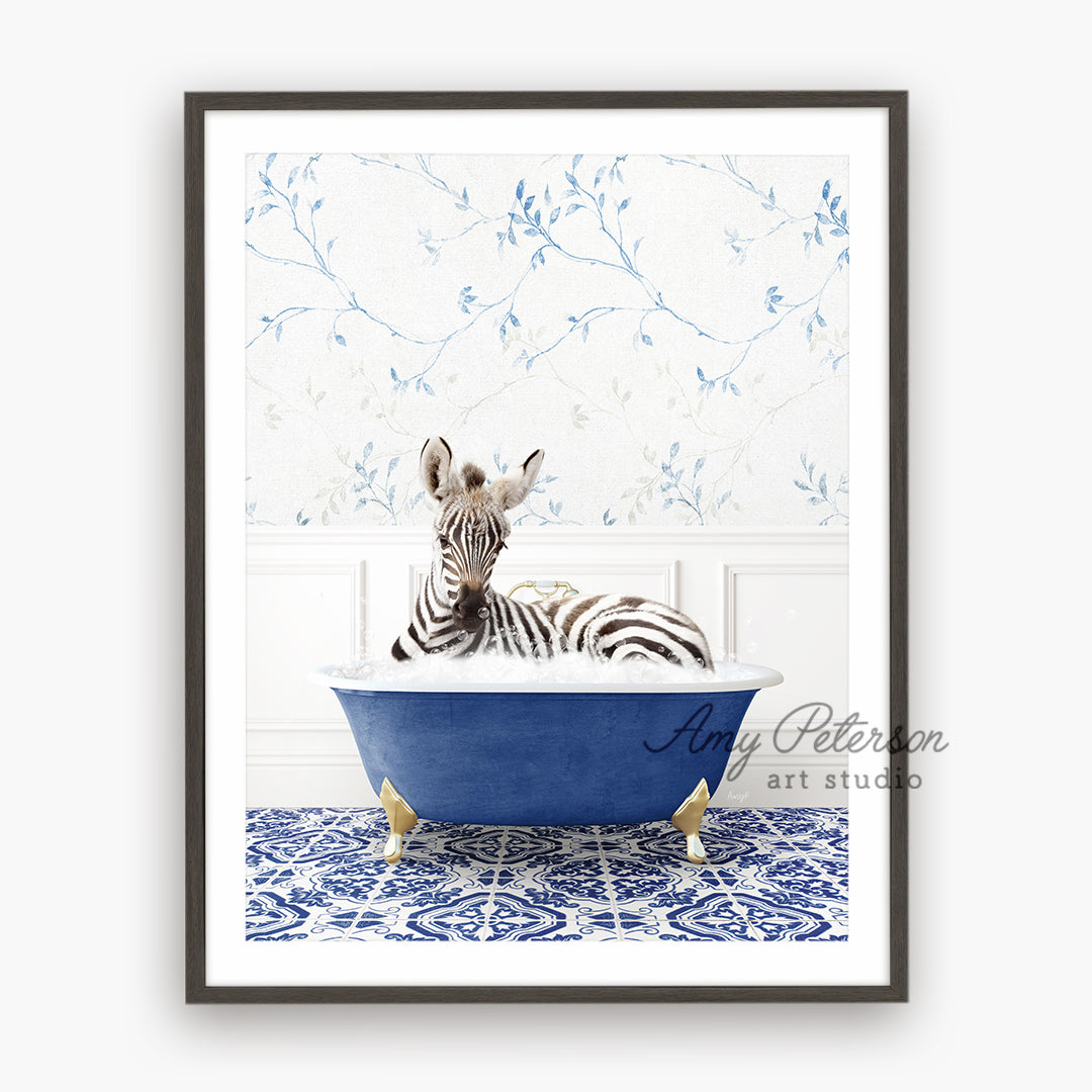 a zebra laying in a blue bath tub