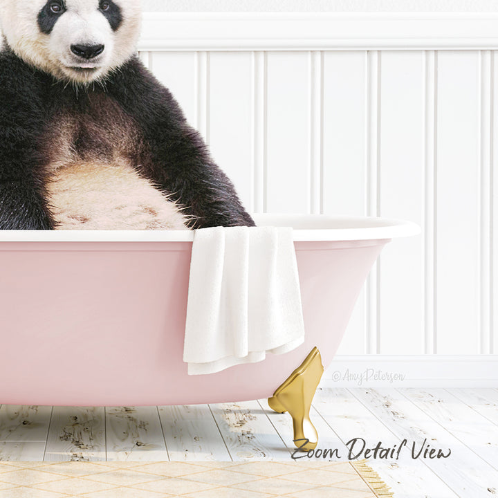A panda bear sitting in a pink bathtub, with a towel and golden object nearby.