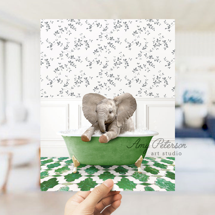 a person holding up a card with an elephant in a bathtub