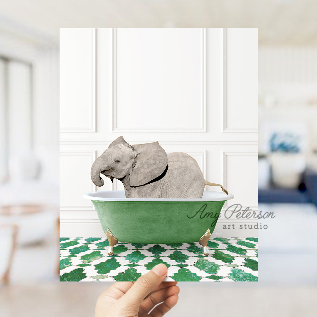 a hand holding a card with an elephant in a bathtub