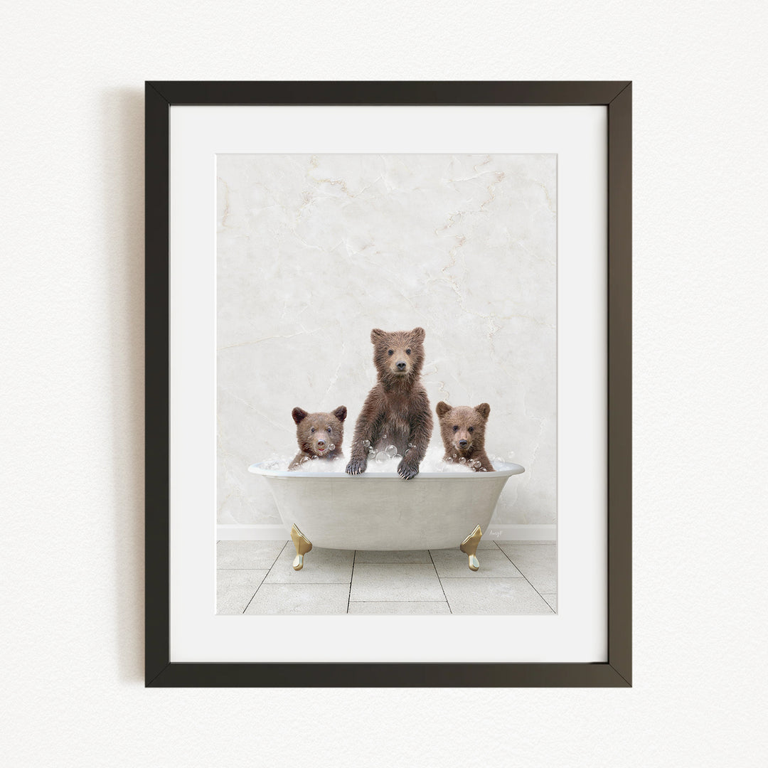 A framed image depicting three bears sitting in a bathtub filled with water.