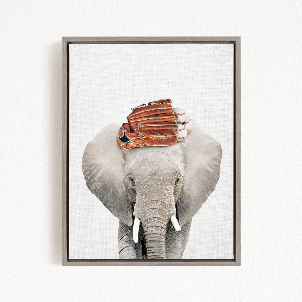 A gray elephant with a baseball glove on its head, standing against a white background.