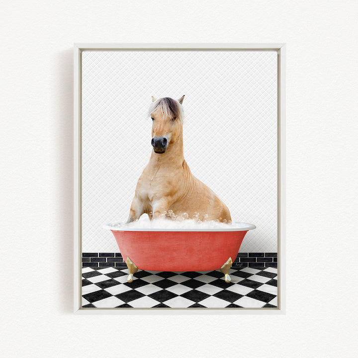 A light brown horse is sitting in a red bathtub filled with water, surrounded by a black and white checkered floor.