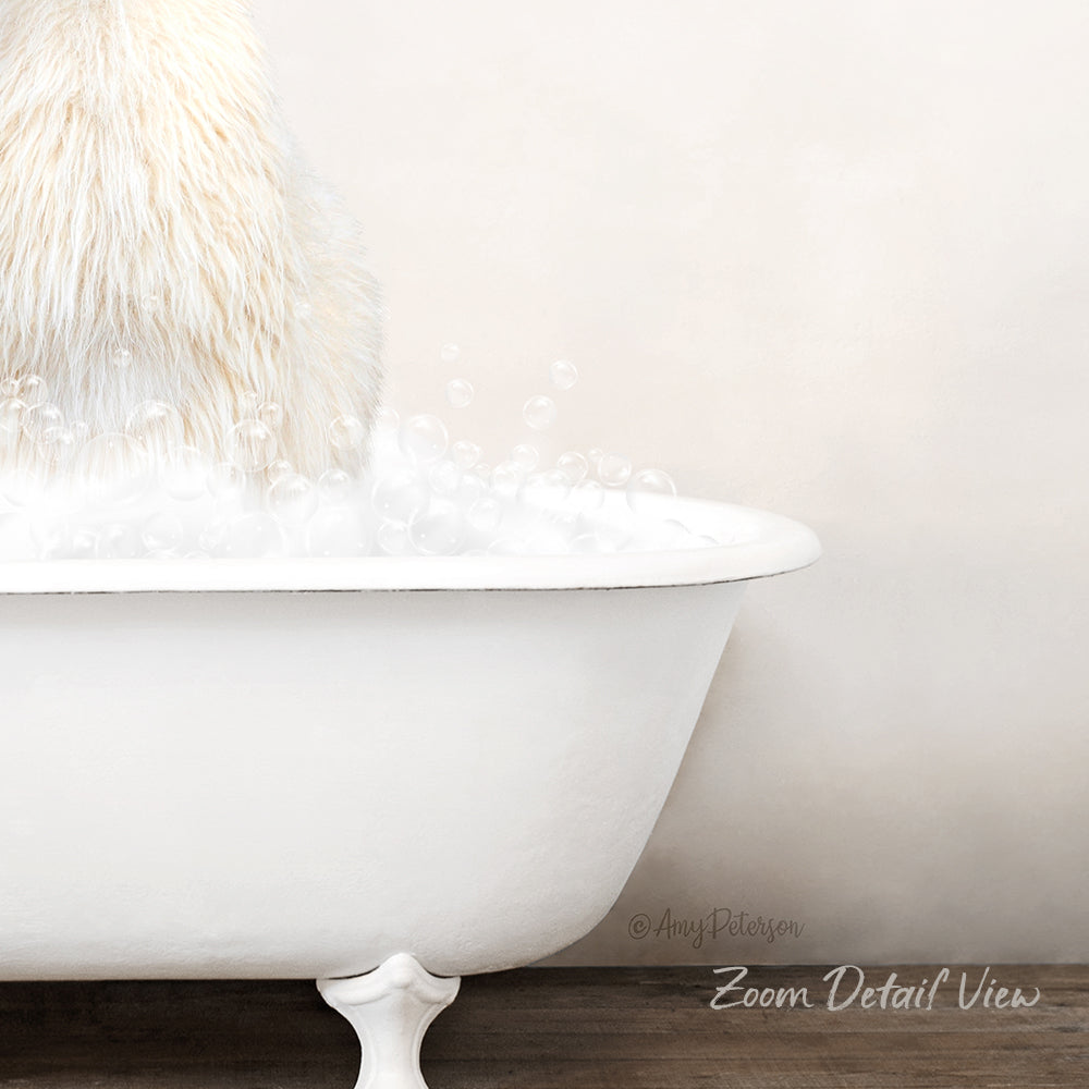 A fluffy white dog is sitting in a white bathtub filled with bubbles, creating a cozy and relaxing scene.