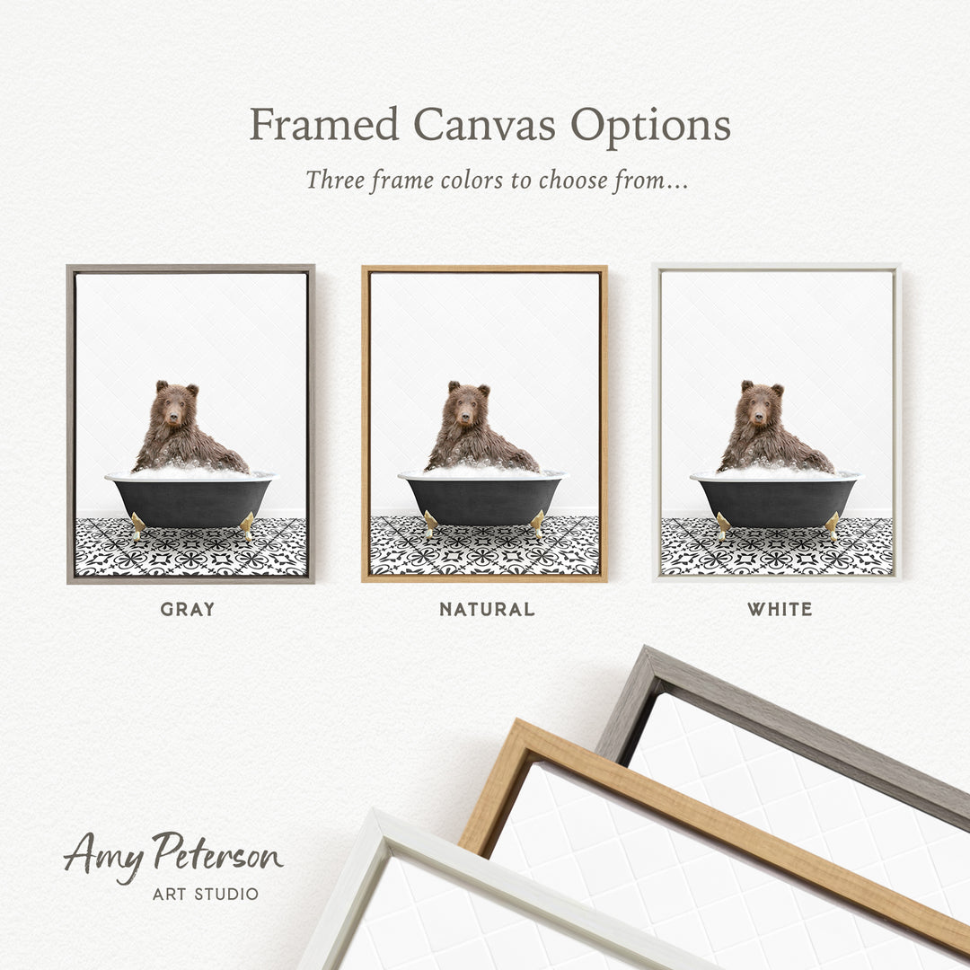 three framed canvas options featuring a brown bear sitting in a bathtub, each with a different frame color: gray, natural, and white.