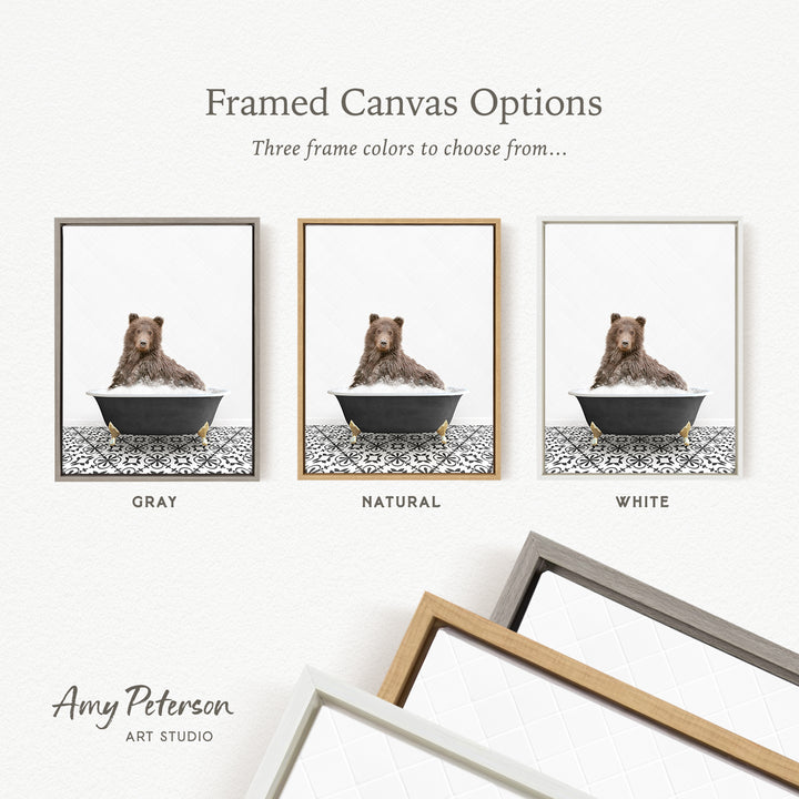 three framed canvas options featuring a brown bear sitting in a bathtub, each with a different frame color: gray, natural, and white.