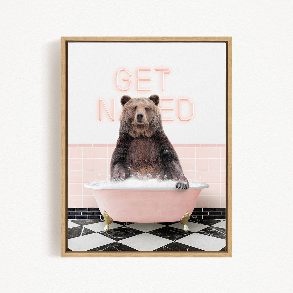 A brown bear sitting in a pink bathtub with the words "GET NICKED" written on the wall behind it.
