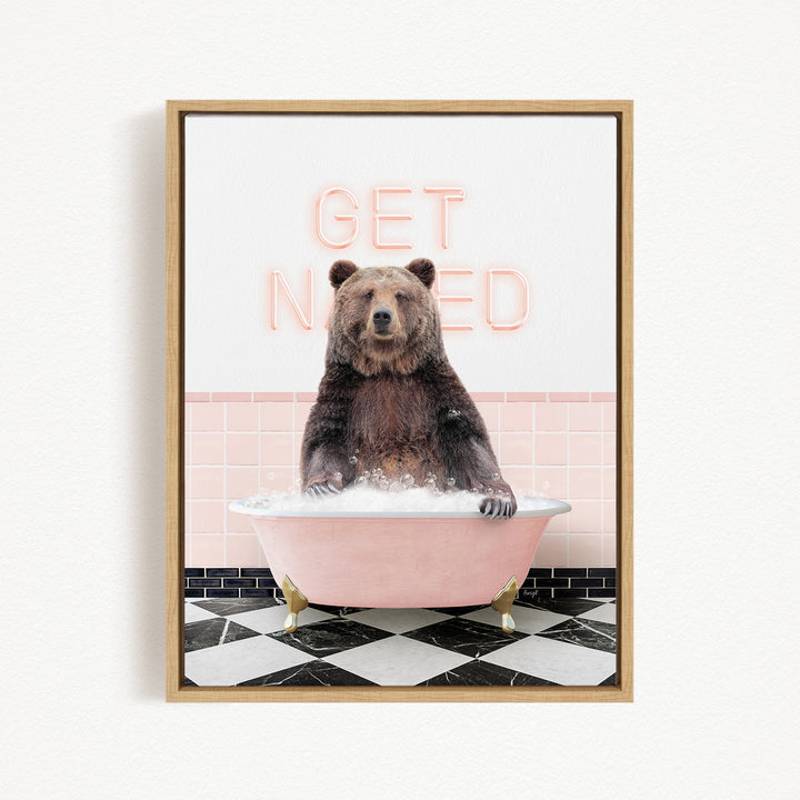 A brown bear sitting in a pink bathtub with the words "GET NICKED" written on the wall behind it.