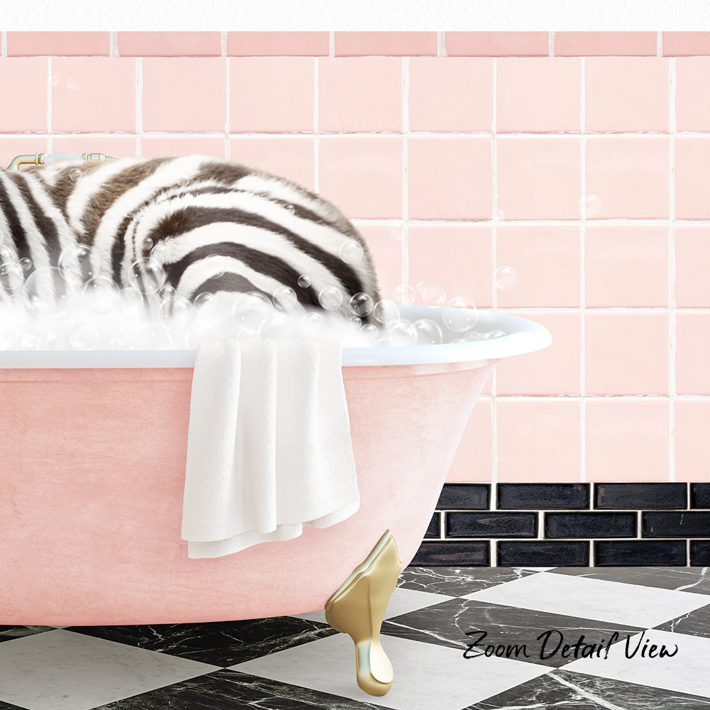 A zebra lying in a pink bathtub filled with bubbles, with a towel hanging on the side and a pink tile wall in the background.