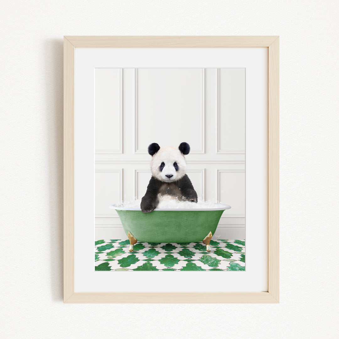 A panda bear sitting in a green bathtub filled with bubbles, surrounded by a green and white patterned rug.