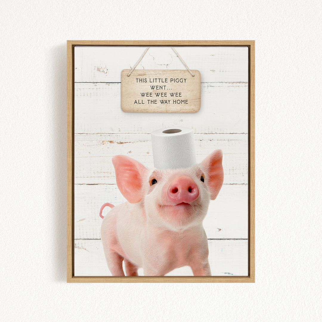 A cute piglet standing on a white wooden background, with a sign above it that reads "This little piggy went wee wee wee all the way home".