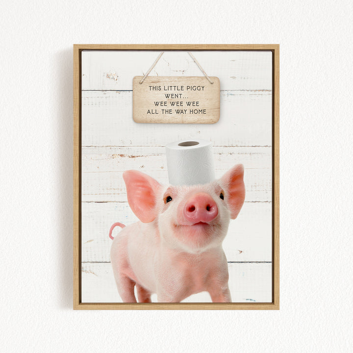 A cute piglet standing on a white wooden background, with a sign above it that reads "This little piggy went wee wee wee all the way home".