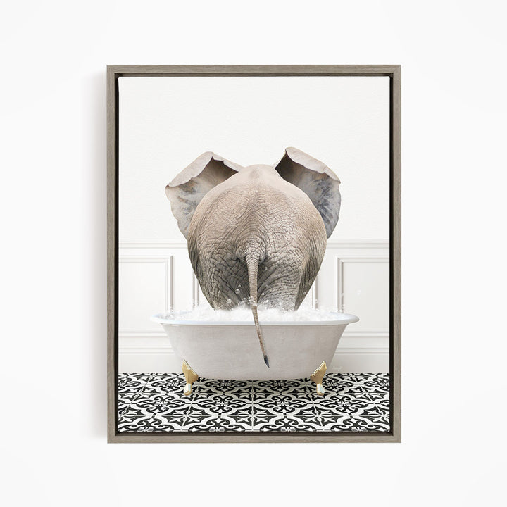 A gray elephant is standing in a white bathtub filled with water, with its trunk submerged in the water.