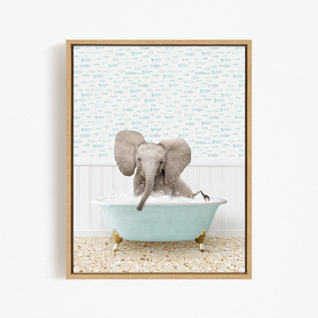 A baby elephant sitting in a light blue bathtub filled with water, surrounded by a pattern of small fish.