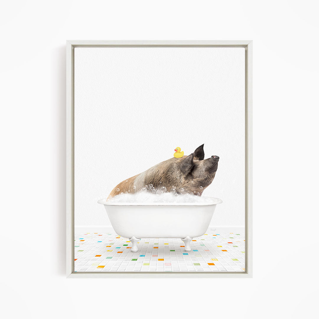 A pig sitting in a white bathtub filled with bubbles, with a rubber duck floating on the water.