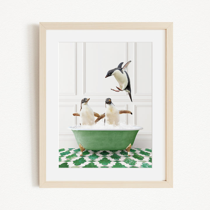 A framed image depicting two penguins sitting in a green bathtub, with one penguin flying towards the other.