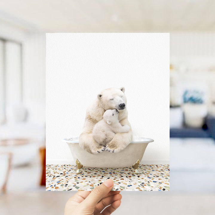 A polar bear and its cub sitting together in a bathtub, with the polar bear appearing to be hugging the cub.