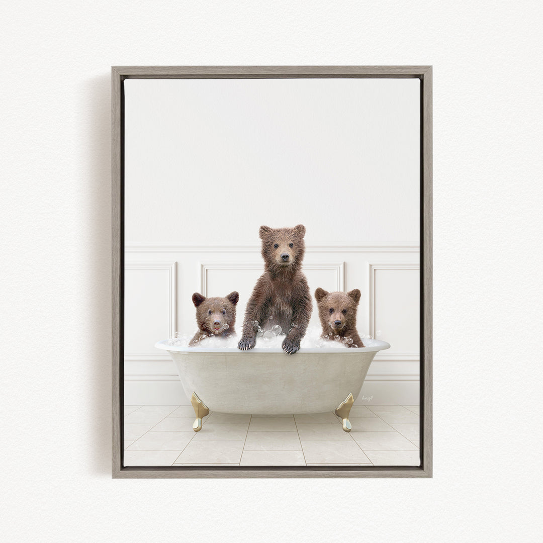Three adorable brown bears sitting in a white bathtub, enjoying a relaxing bath together.
