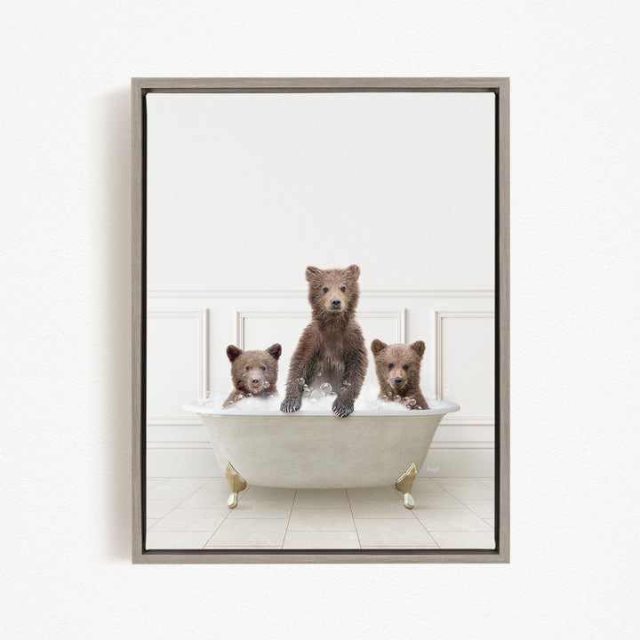Three adorable brown bears sitting in a white bathtub, enjoying a relaxing bath together.