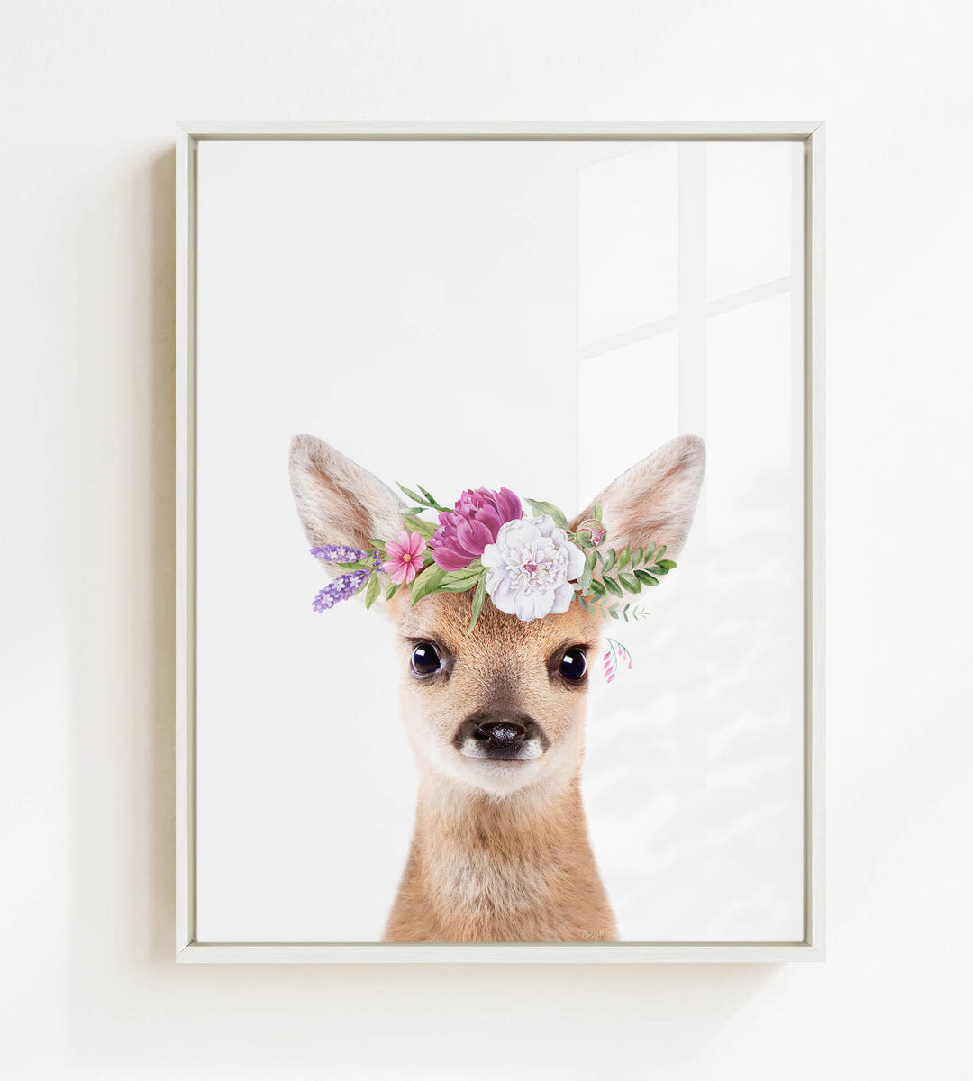 A deer wearing a flower crown on its head, with a white background.