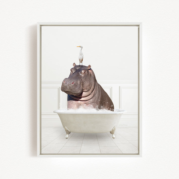 A large hippopotamus sitting in a bathtub, with a white bird perched on its head.