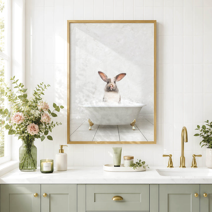a bathroom with a framed picture of a rabbit sitting in a bathtub, surrounded by flowers and candles.