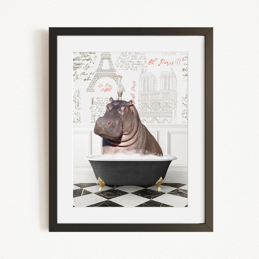 A framed image depicting a large hippopotamus sitting in a bathtub, with a bird perched on its head.