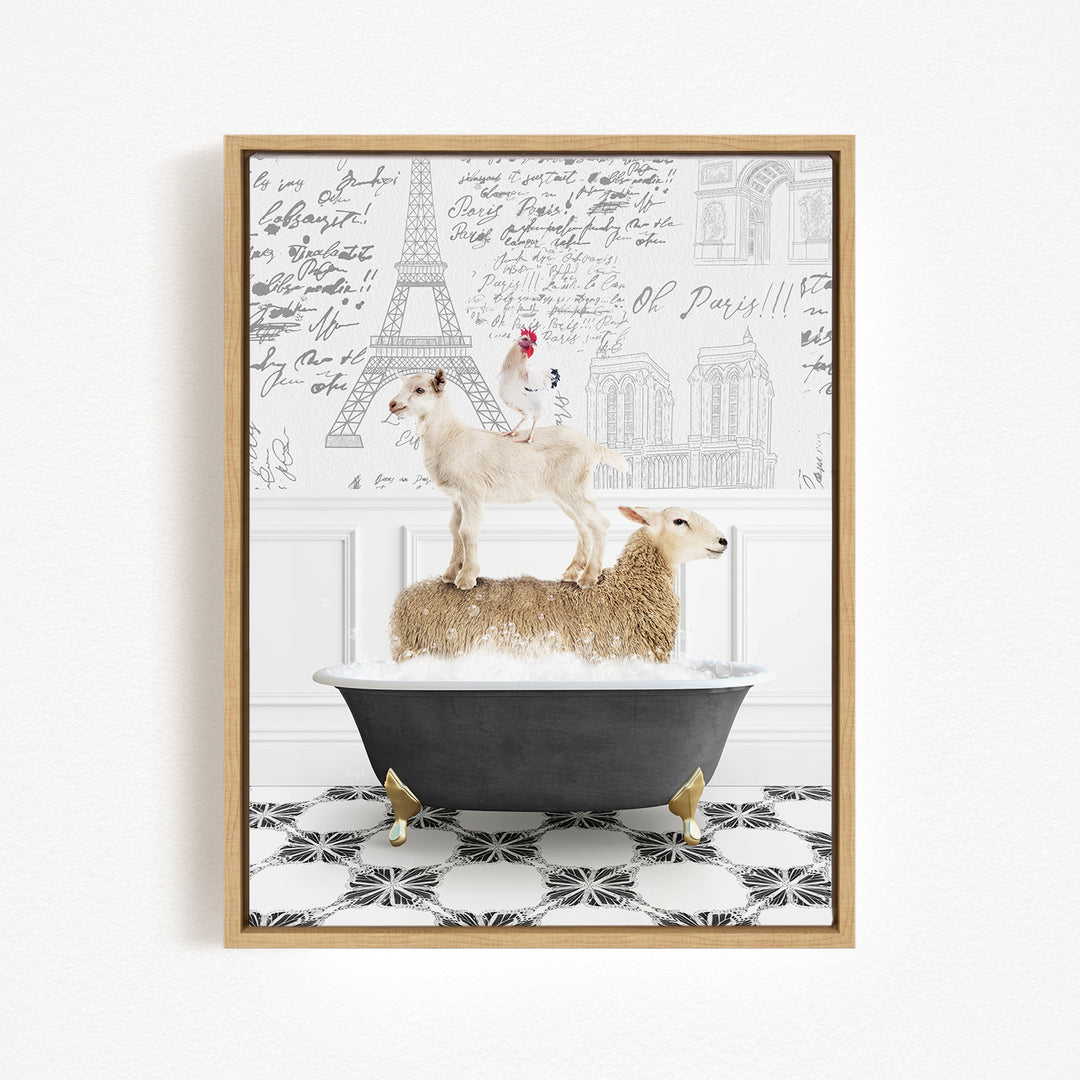 A framed image depicting a white sheep standing on a black bathtub, with a rooster perched on top of the sheep. The background features a wall with various inscriptions and illustrations, including the Eiffel Tower.
