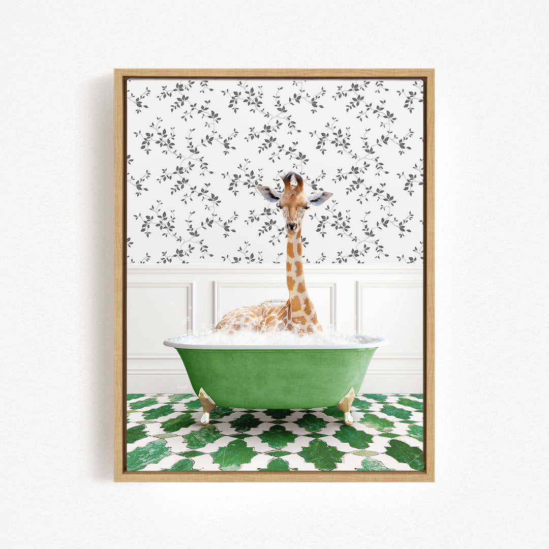 A giraffe is sitting in a green bathtub filled with water, surrounded by a patterned wall and green and white floor tiles.