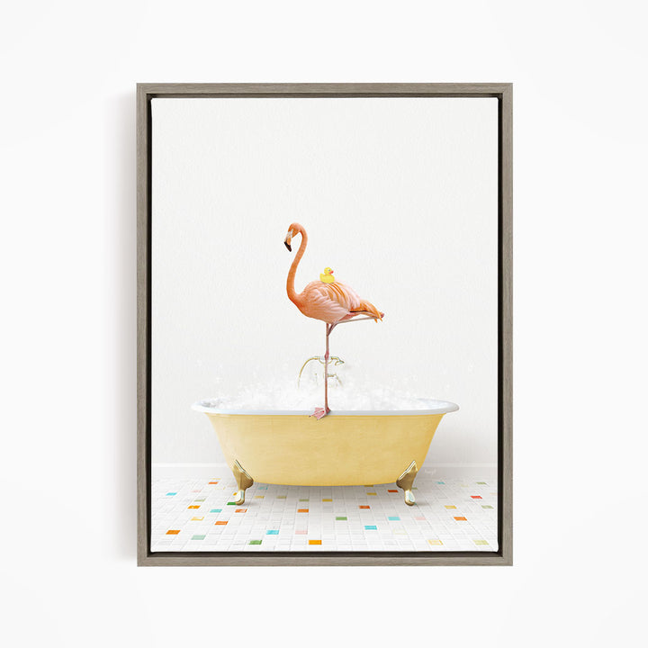 A flamingo standing on a yellow bathtub filled with bubbles, with a yellow rubber duck floating on its back.