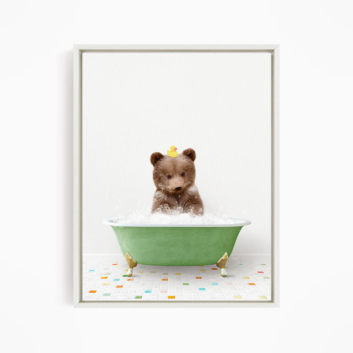 A brown bear sitting in a green bathtub filled with bubbles, with a yellow rubber duck floating on the water.