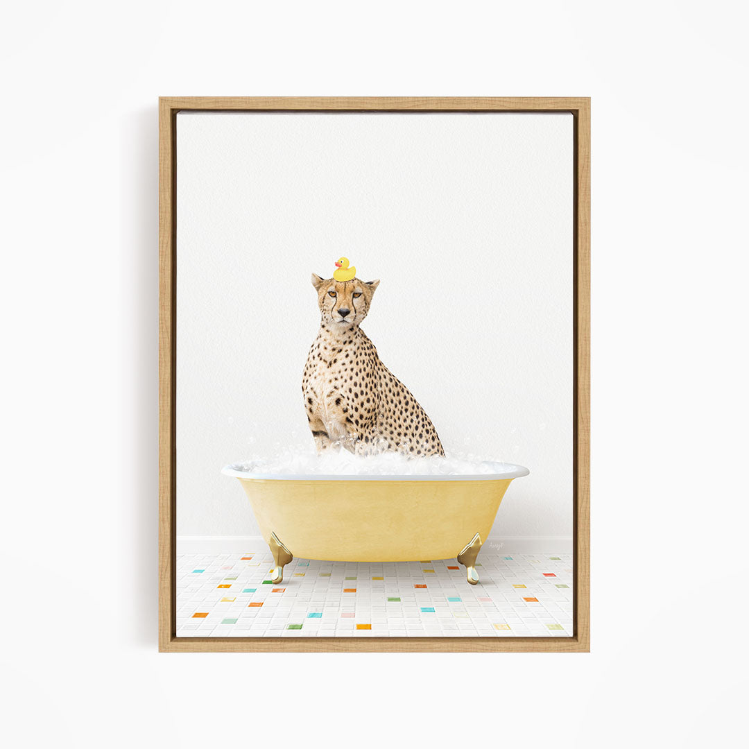 A cheetah sitting in a yellow bathtub filled with bubbles, wearing a yellow rubber duck hat.