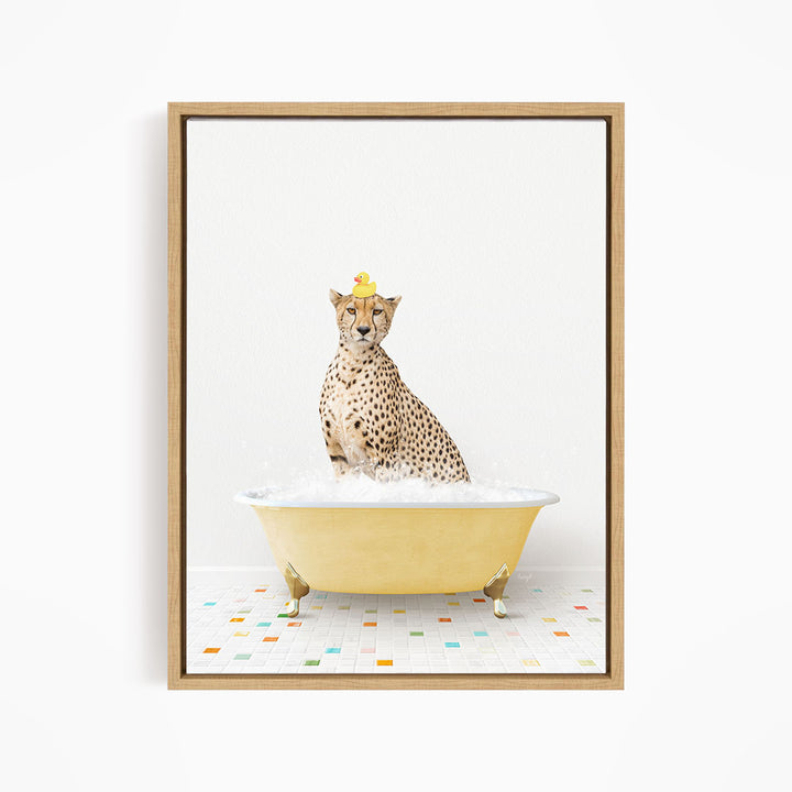 A cheetah sitting in a yellow bathtub filled with bubbles, wearing a yellow rubber duck hat.