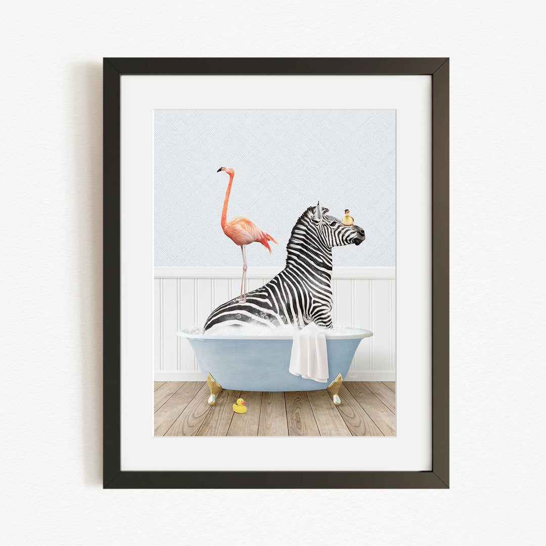 A framed illustration depicting a zebra sitting in a bathtub, with a flamingo standing on its back and a bird perched on its head.