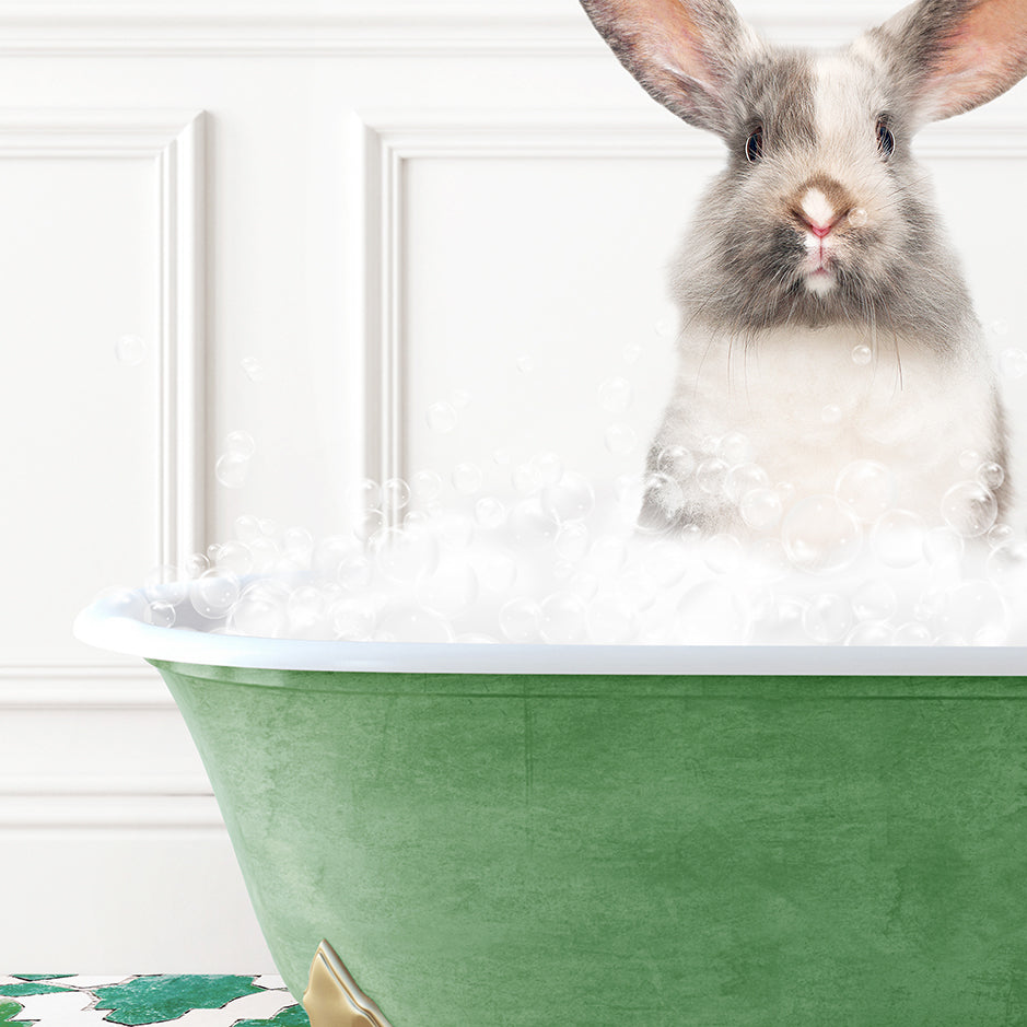 a rabbit sitting in a bathtub full of bubbles