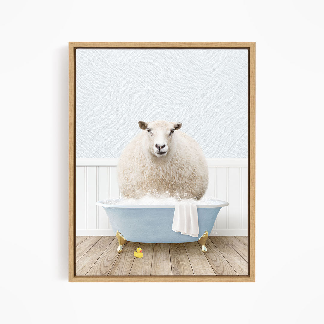 A fluffy white sheep sits in a blue bathtub filled with bubbles, surrounded by yellow rubber duckies.