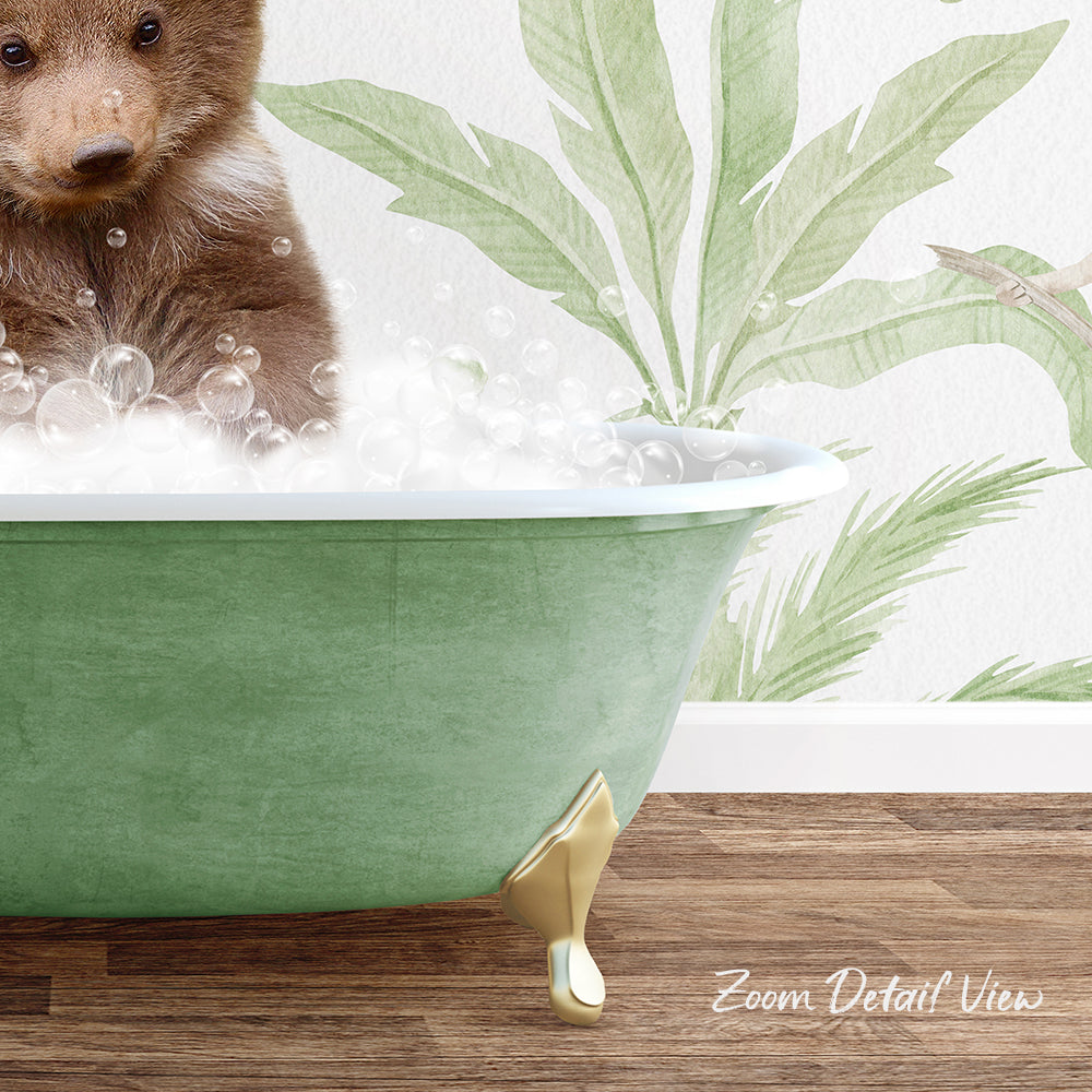 A brown bear is sitting in a green bathtub filled with bubbles, with a tropical plant wallpaper in the background.