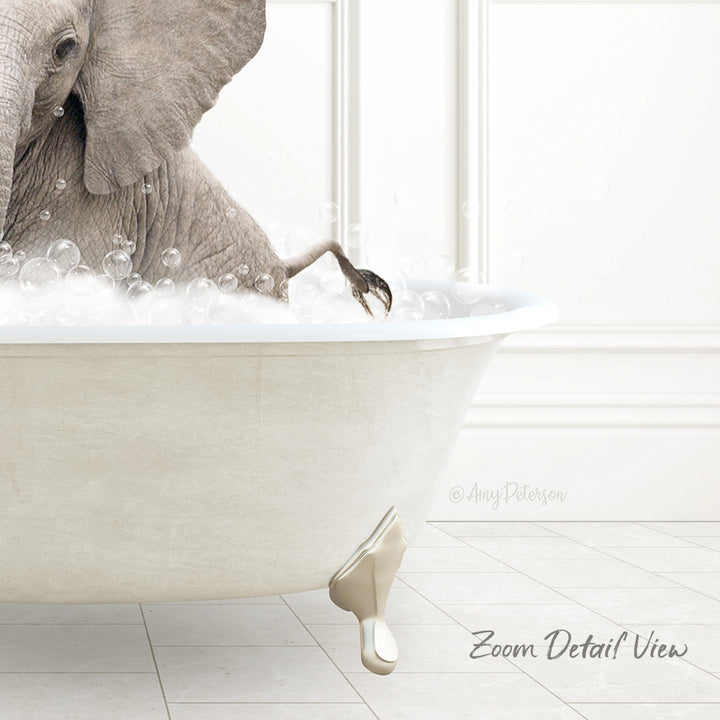 A large elephant is sitting in a bathtub filled with bubbles, creating a whimsical and playful scene.