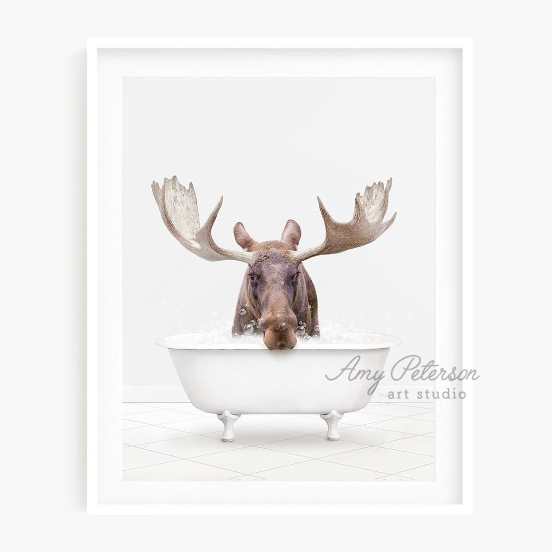 a moose is taking a bath in a bathtub