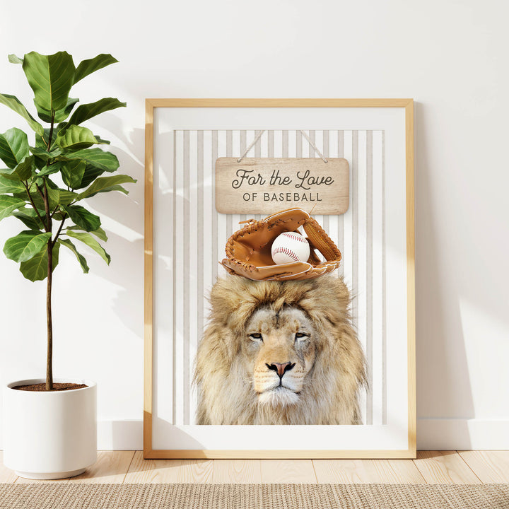 A framed print of a lion wearing a baseball glove and holding a baseball, with the text "For the Love of Baseball" written on the sign.